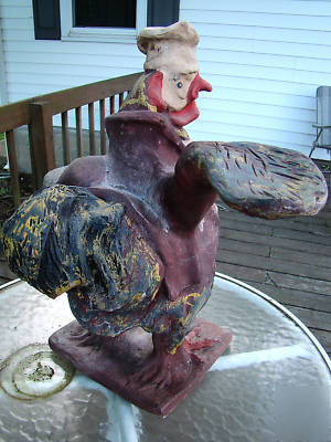 Rooster waiter server chef statue old restaur. display 