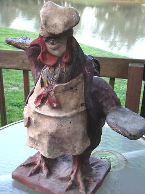 Rooster waiter server chef statue old restaur. display 