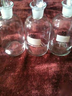 Two (2) wheaton b.o.d bottles with glass stoppers